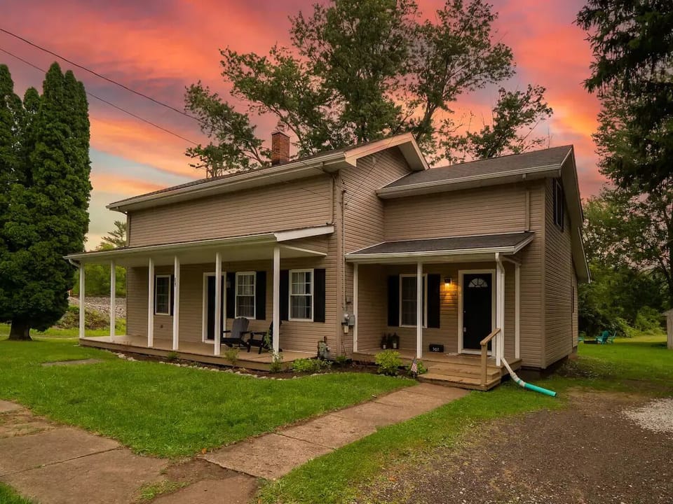 Gravel driveway next to the house can fit up to 4 cars if pulled up and parked 2x2