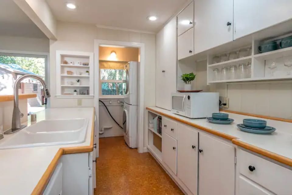 Fully equipped kitchen with full size washer and dryer. 