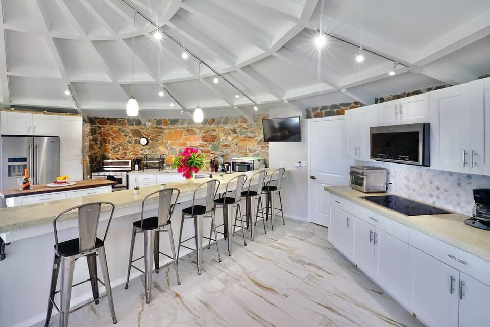 "The villa had plenty of amenities, from the spacious outdoor seating, air conditioning in all rooms, a game room, outdoor pool & jacuzzi, updated kitchen as well as a beautiful sight to see at the center of tutu bay."