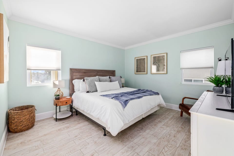 Spacious primary ensuite with king bed and plush bedding (Villa 2)