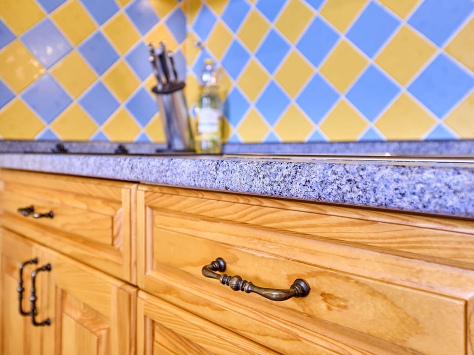 Cabinetry, Property, Drawer, Wood, Interior Design, Dresser, Rectangle, Flooring, Yellow, Countertop