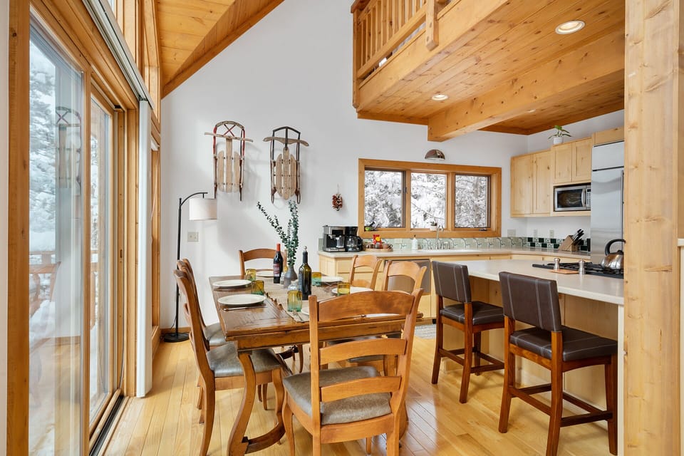 Dining Table next to island bar seating