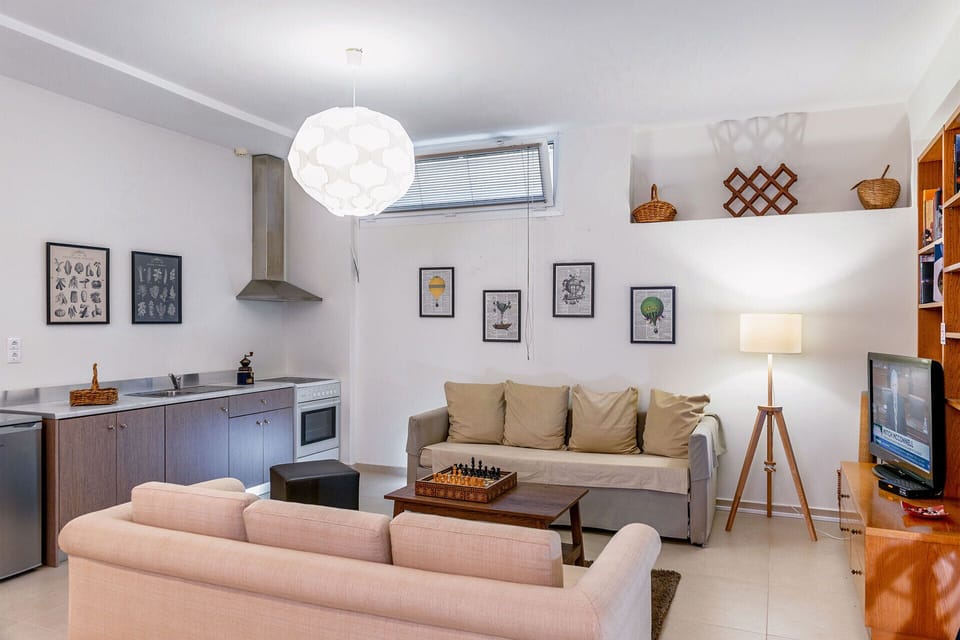 Living room located at the basement floor and full kitchen.