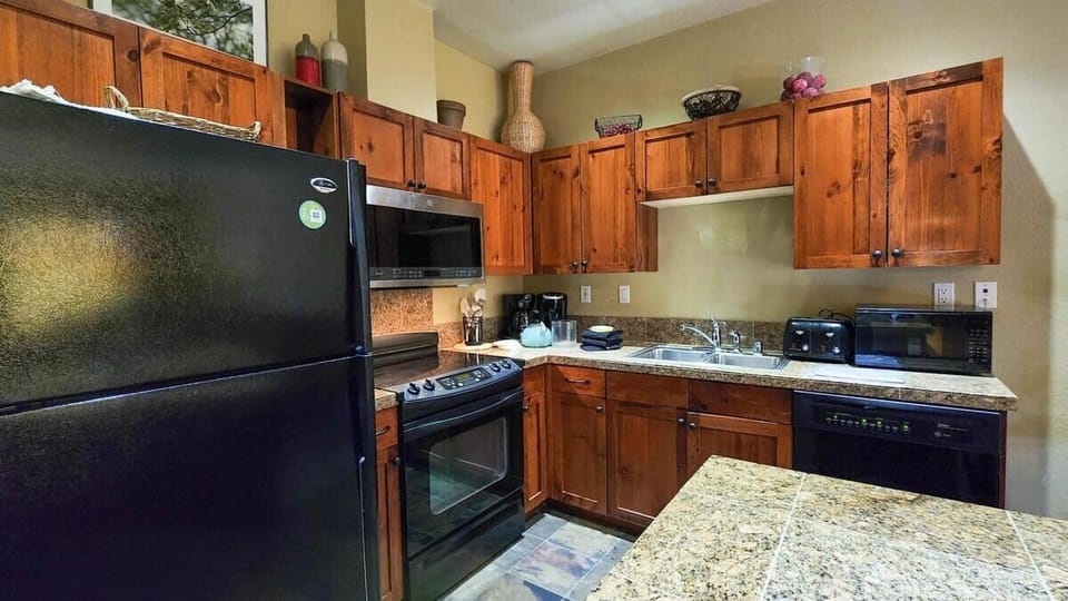 The fully stocked kitchen includes all the appliances and basic cookware you will need to whip up a delicious meal.