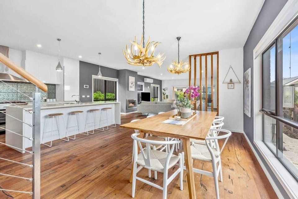 Enjoy meals in the inviting dining space, with chandeliers that evoke a Scandinavian feel and enhance the dining experience