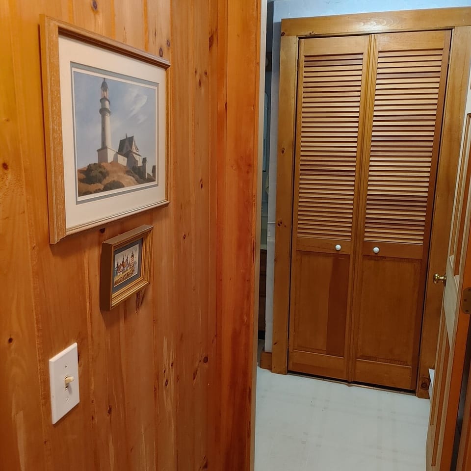 Hallway to down bath. Washer/dryer behind doors.