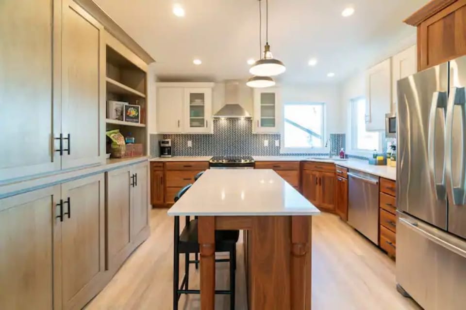 Full kitchen with quartz countertops and stocked with all the essentials
