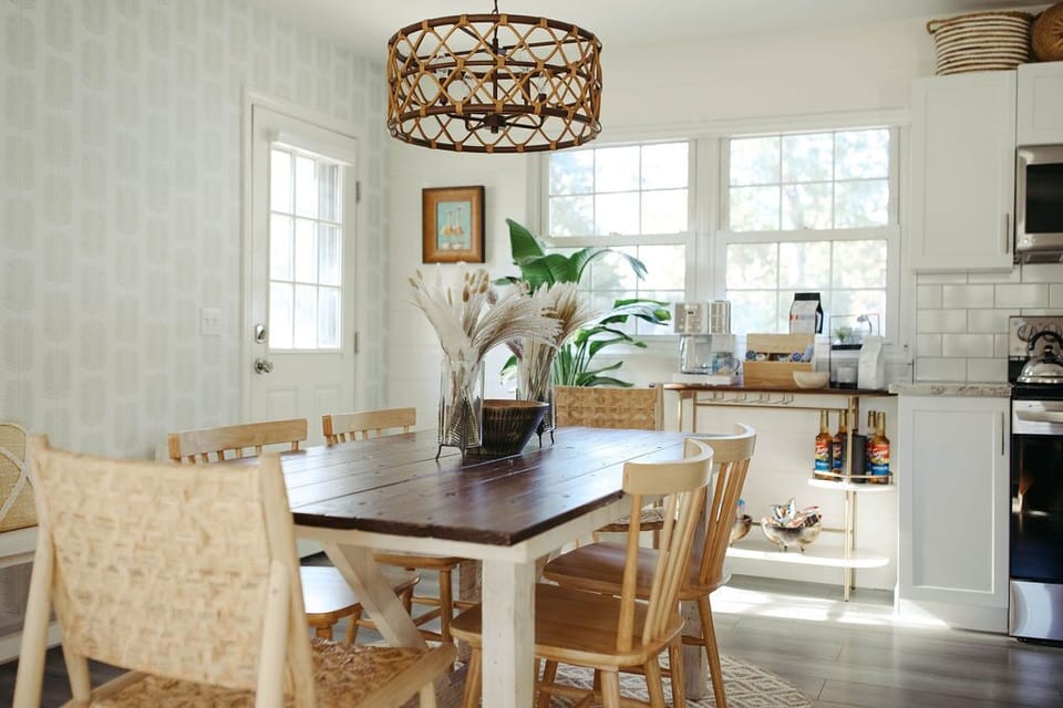Dining room with table for 6. High chair available w/ request and island seats 3