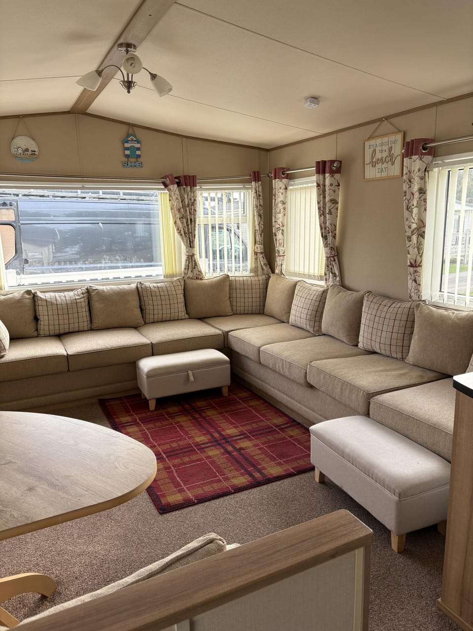 Cozy living room with panoramic window views and plush seating