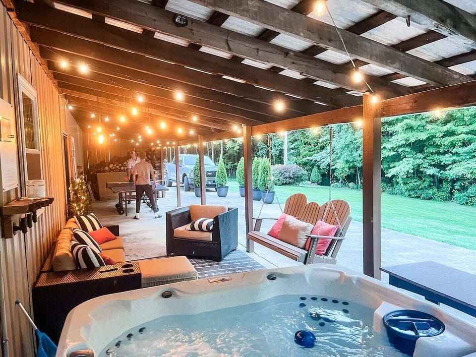Soak, sip, swing, and serve! Whether you're in the hot tub, watching the game, lounging by the fire, or crushing your crew at ping pong or cornhole—this is your place to play.