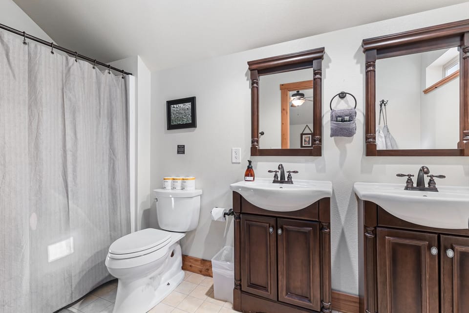 Double-sink full bathroom ensuite to main bedroom upstairs