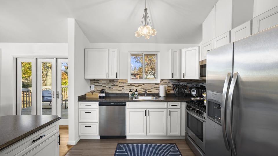 Step into this stunning white-on-white kitchen, for cooking and entertaining.