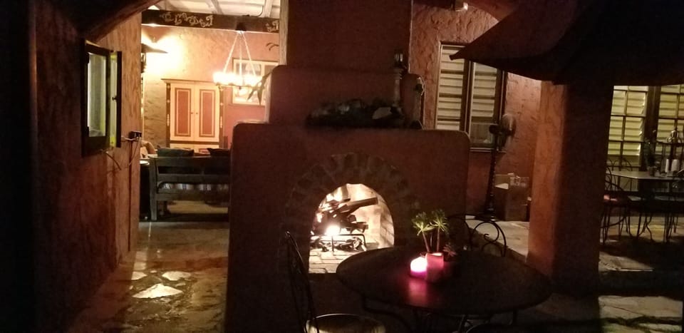 Outdoor fireplace. This is a shared space with the tenant in the casita