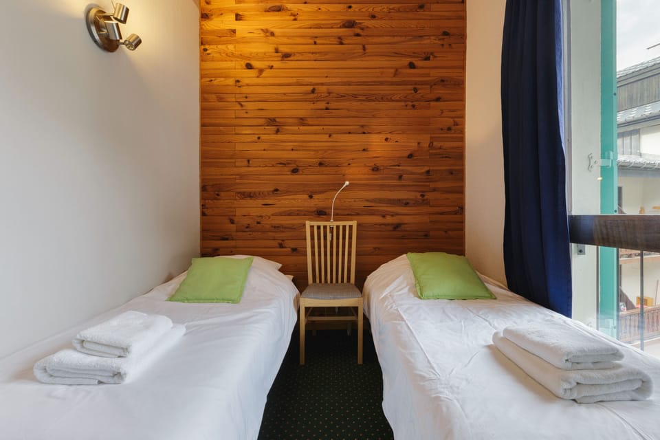 Room with two single beds