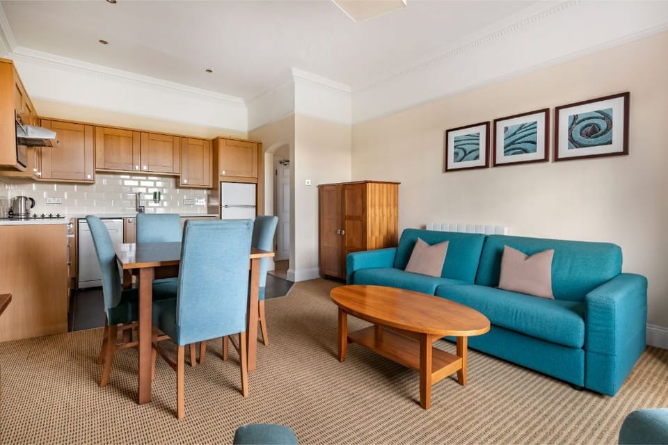 A living area that combines comfort with a pop of color, ideal for unwinding or entertaining.