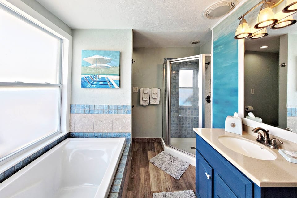 Private bathroom features a new garden tub...