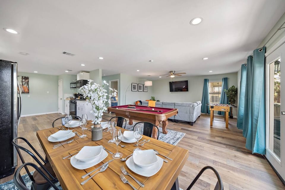 Spacious dining table that sits 6 with full tableware and silverware included.