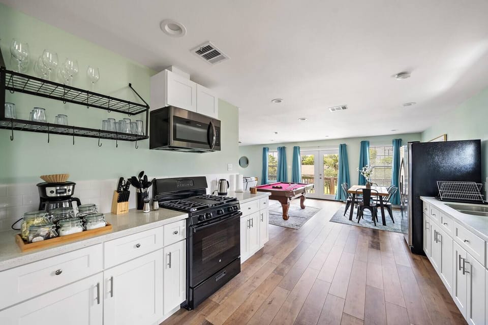 Fully equipped kitchen. Coffee bar includes regular coffee, decaf, tea, sugar, cream, and sweetener.