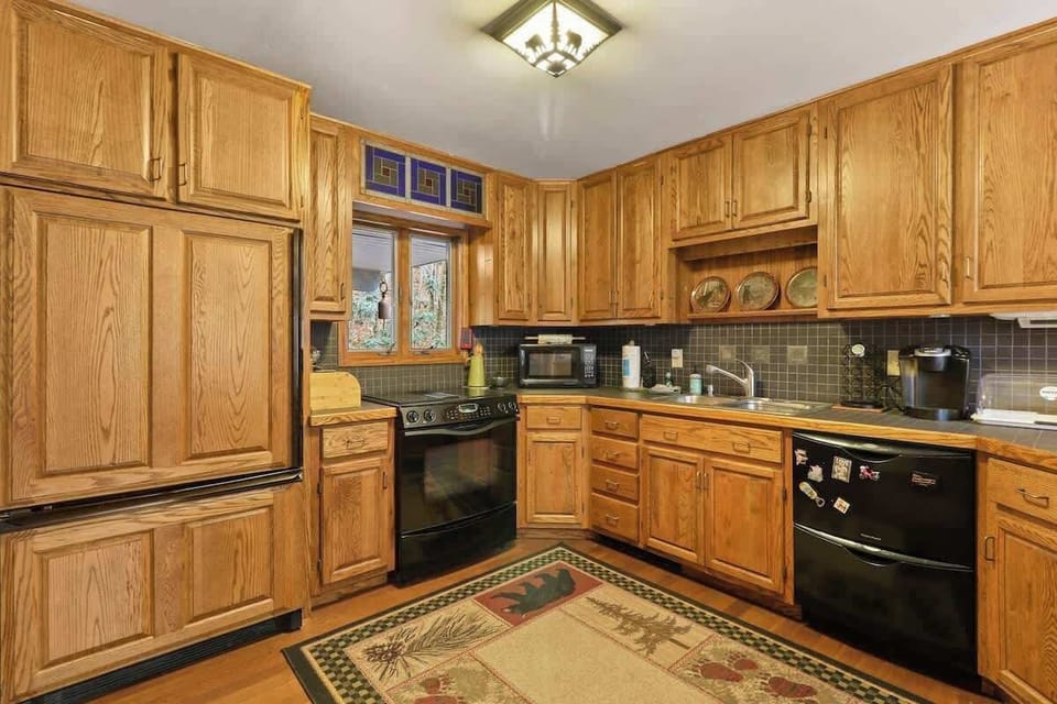 Experience a culinary sanctuary with a view in our well-stocked kitchen, where cooking harmonizes with serenity amidst breathtaking landscapes framed by windows