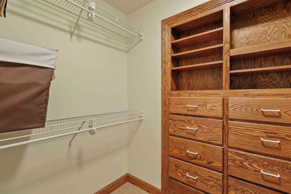 Our well-appointed walk-in closet in the master bedroom, ready to meet your storage needs