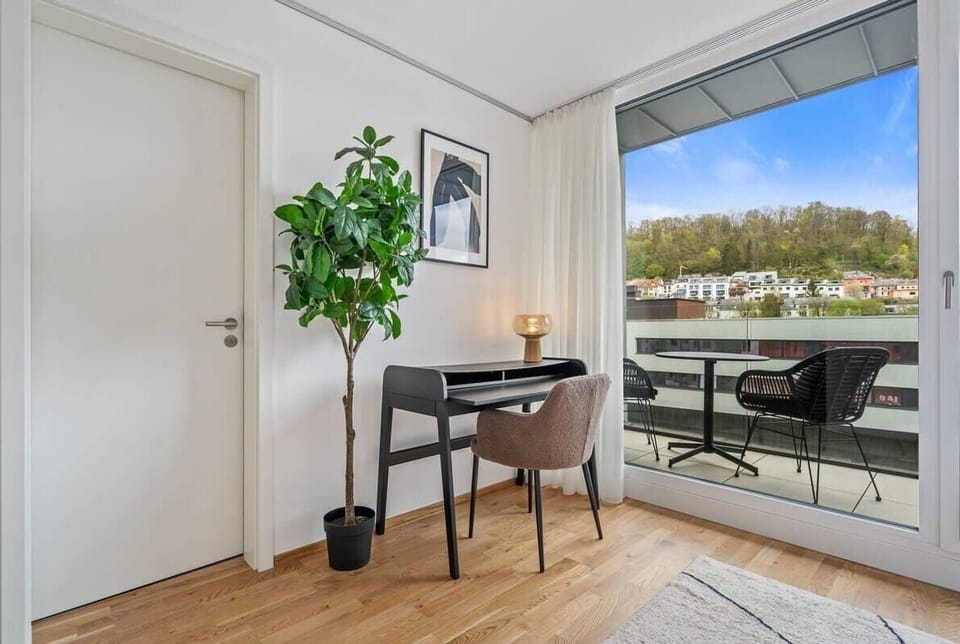 Cozy corner desk with a view, perfect for staying productive or creative.