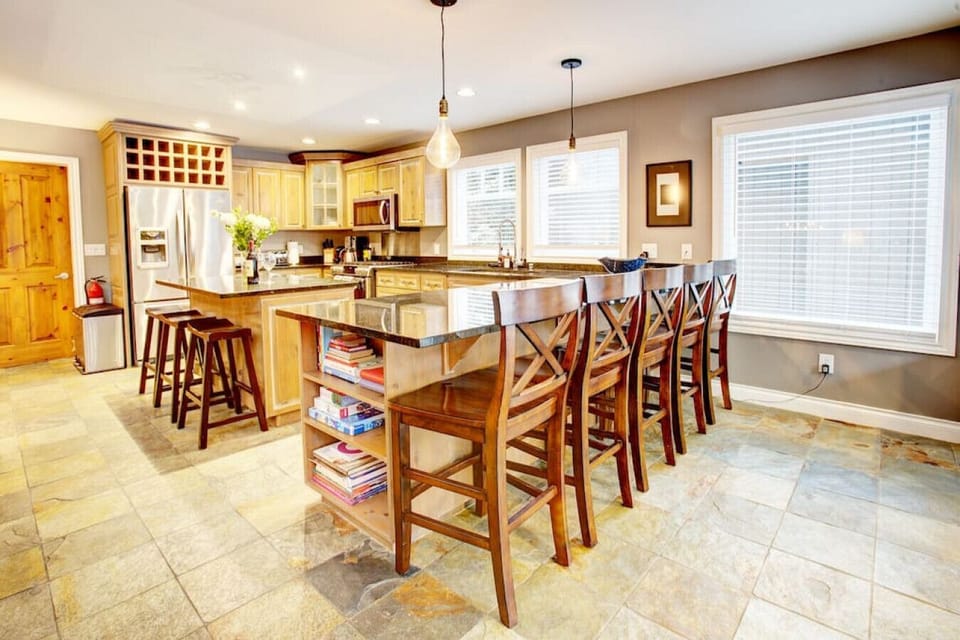 An extended peninsula counter that seats another 5 persons. `We did lots of cooking at the house and found the kitchen VERY well stocked with good quality pots, pans, utensils, appliances, BBQ, kitchen tools, condiments and sauces, etc. `-Mark