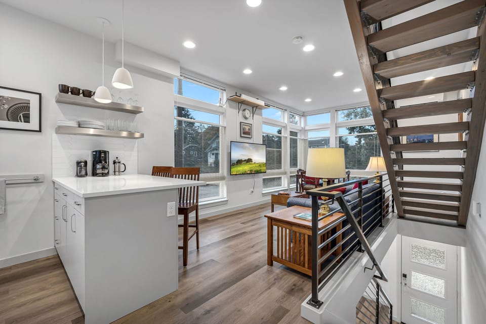 2nd level - kitchen, small dining, and living room with a 55" TV.