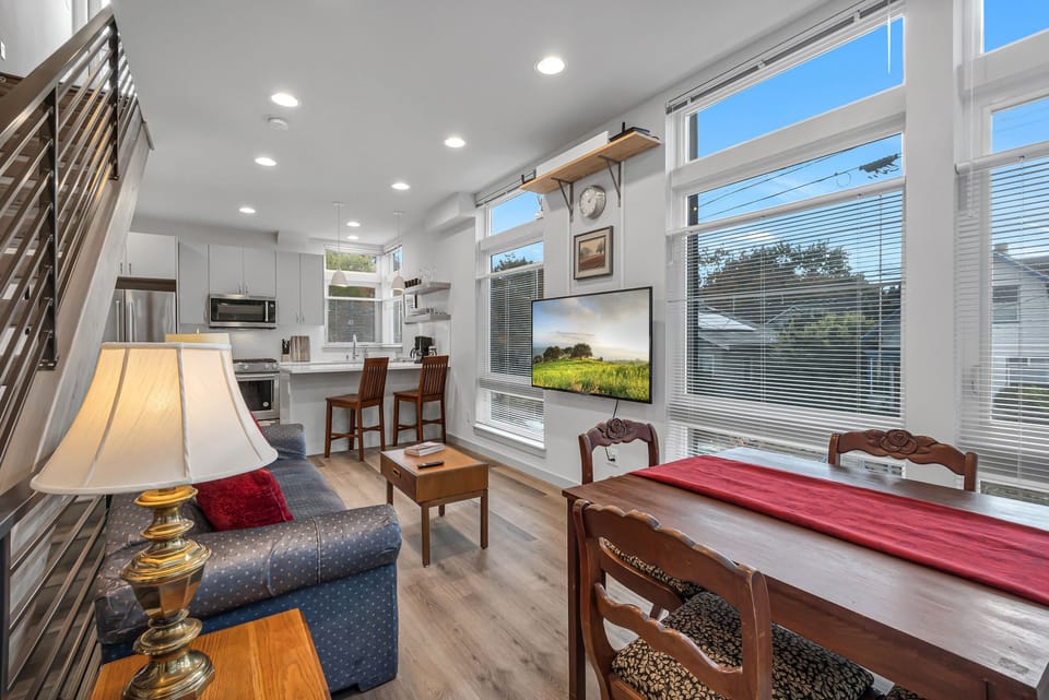 2nd level - kitchen, small dining, and living room with a 55" TV.
