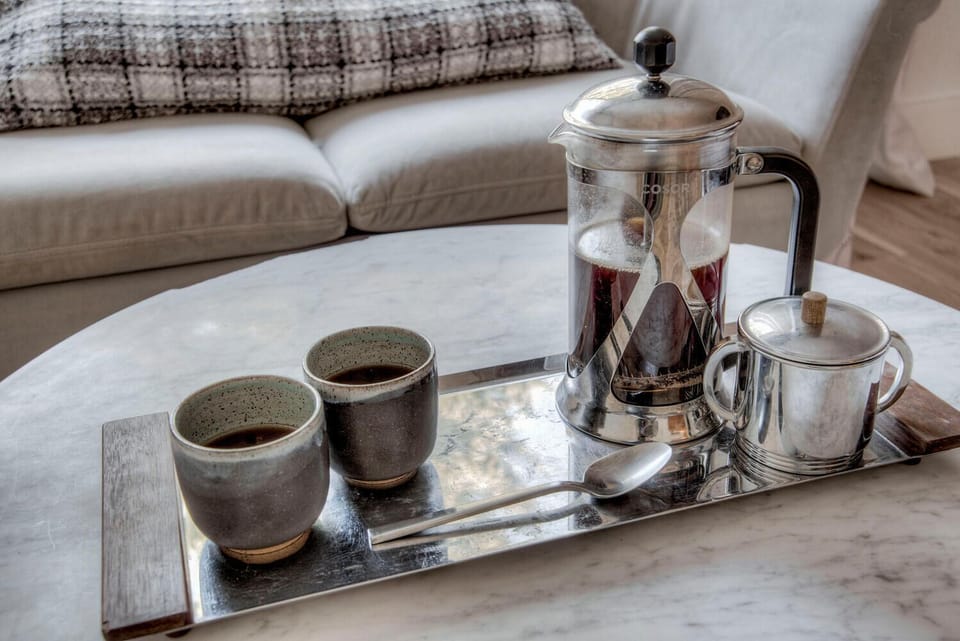 The seating area in master is a great place to enjoy your morning coffee!