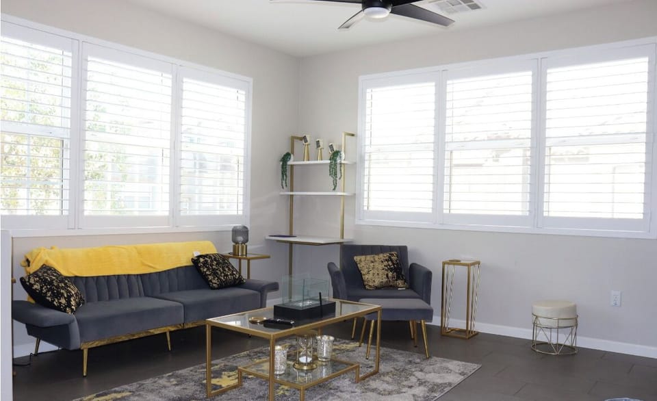 Living area has a dedicated laptop work station with plenty of natural light