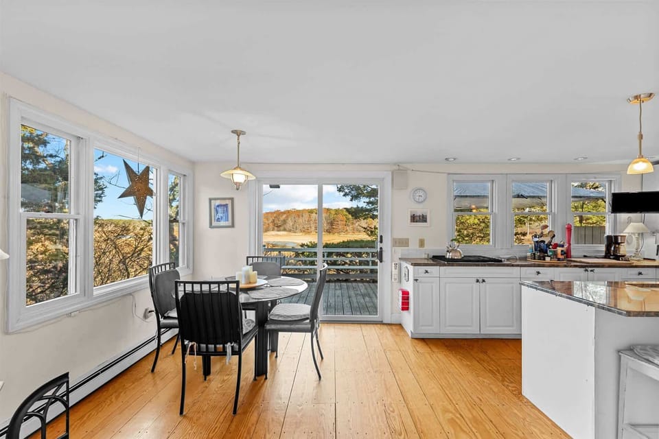Bright kitchen with sliding doors that lead right out to the deck for easy indoor-outdoor summer living.