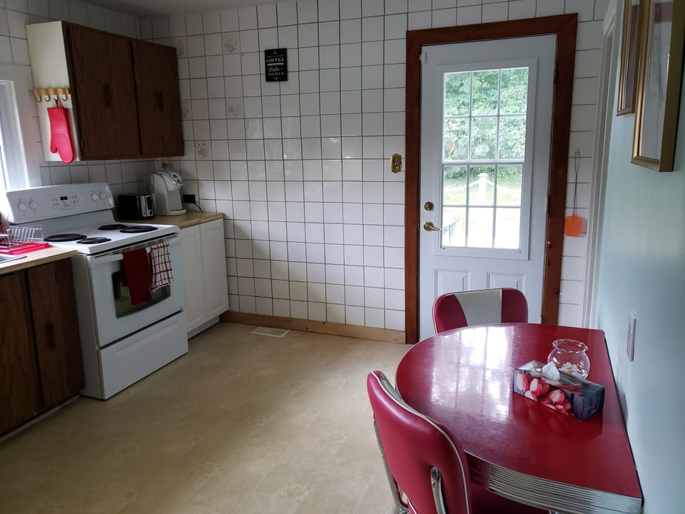 small eating area and door to back yard
