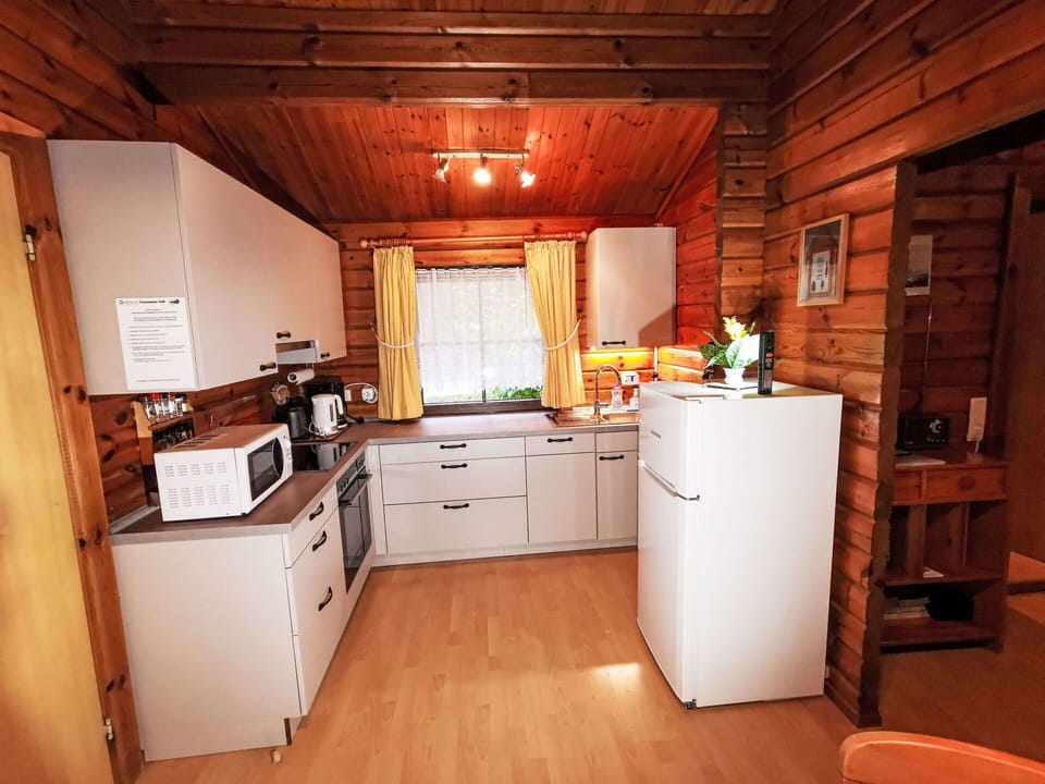 Cabinetry, Furniture, Countertop, Drawer, Kitchen, Chair, Wood, Interior Design, Flooring, Floor