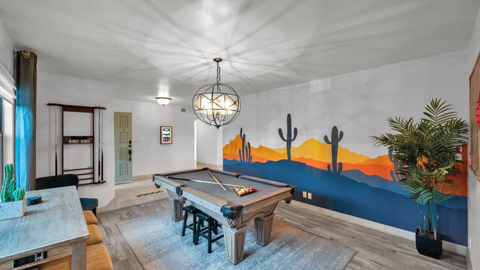 Shoot some pool in your desert oasis game room with a vibrant mural.
