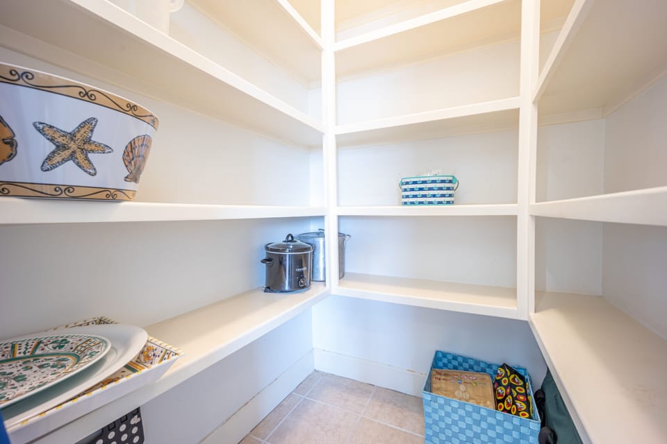 This walk in pantry allows you to store all the food and supplies you need.