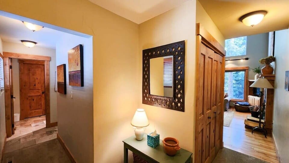The well-decorated foyer greets you as you enter the home where you can either take the hallway to your left or straight head to the main living space.