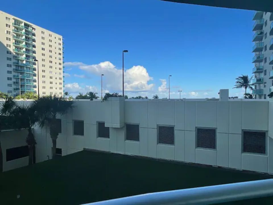 Balcony gets sounds, smells, palm trees and feel of the ocean it's beside