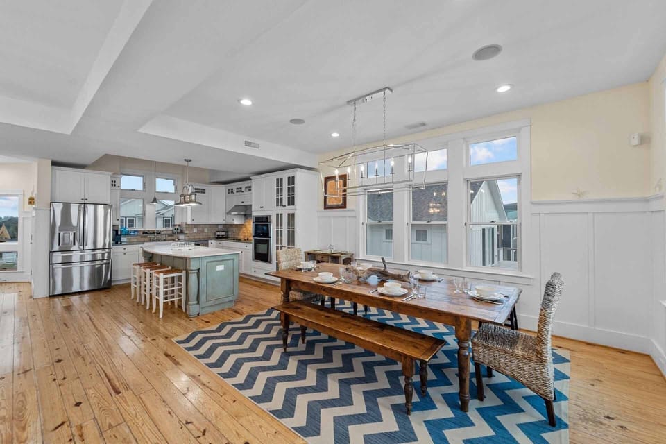 The main dining table is conveniently located directly next to the kitchen.