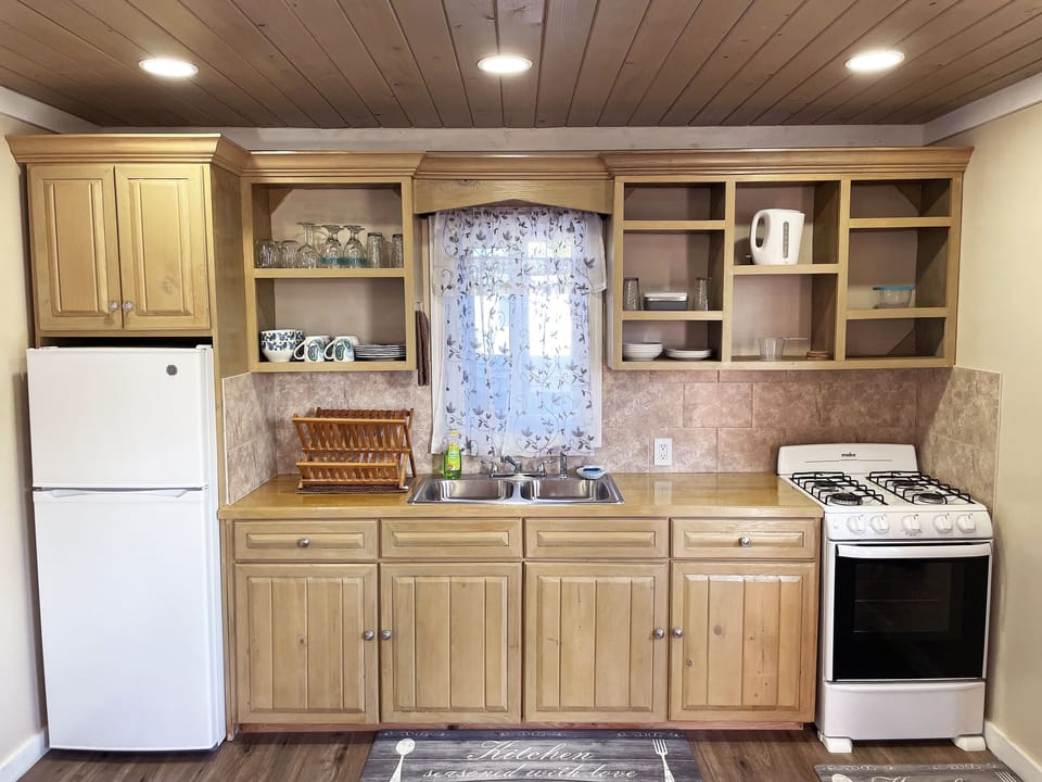 Full size open kitchen with everything you need for cooking at home.
