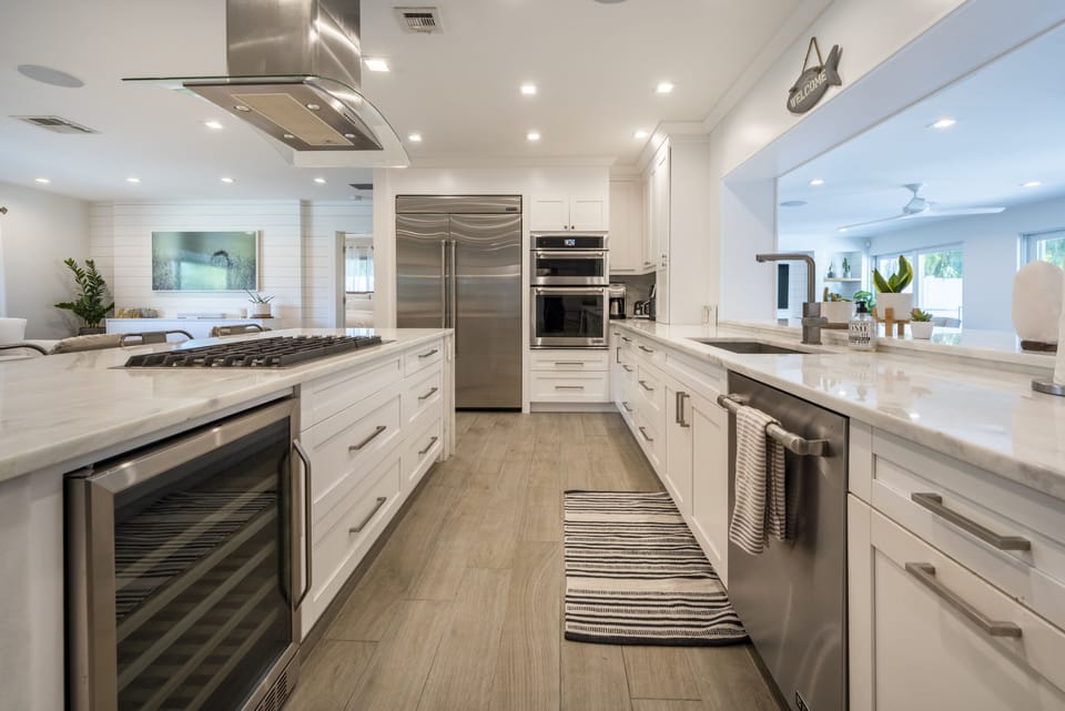 Wine fridge, dishwasher, gas range, ovens, dual-side refrigerator and more!