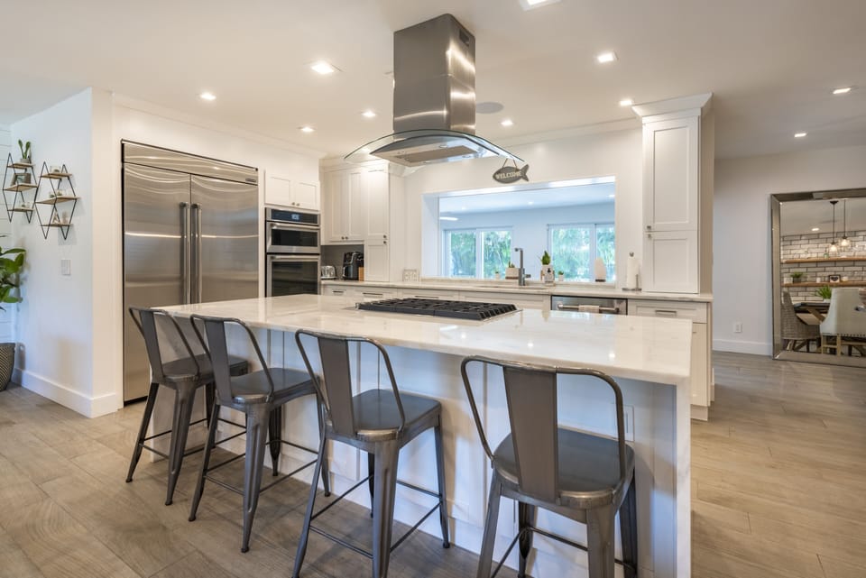 Bar seating in the kitchen lets the conversation keep flowing during meal prep!