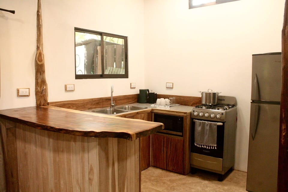 The kitchen has a gas stove and oven as well as a built-in microwave.