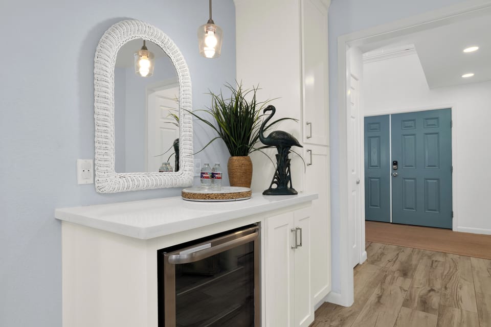 1st floor hallway, bev fridge, 15 beach towels kept in cabinets and front door 