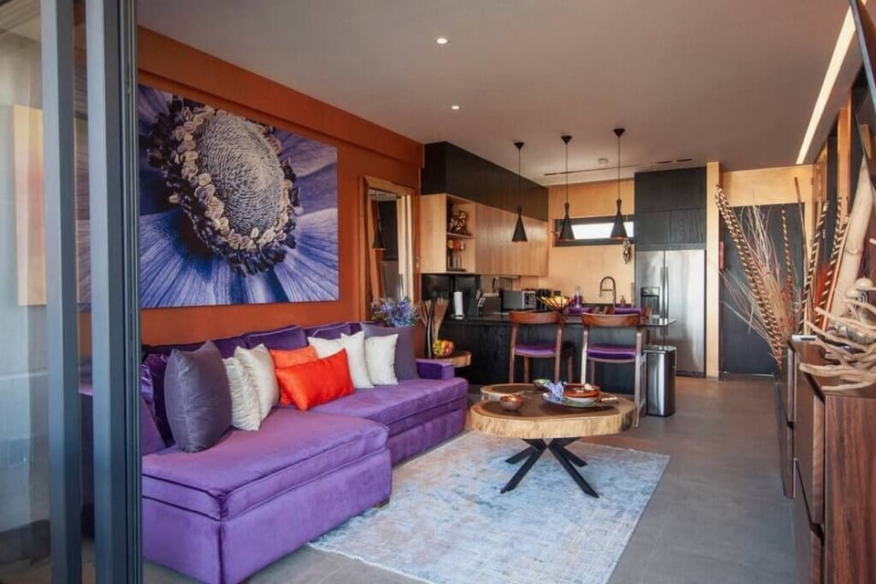 Indoor/Outdoor living - living room from balcony. Wall of windows slide open