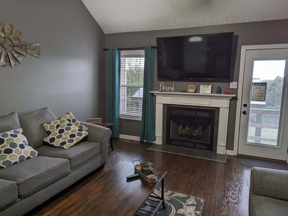 Family games and tv remote can be found on the coffee table.