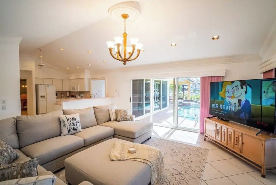 Living room gel comfortable sofa with pool and canal views.