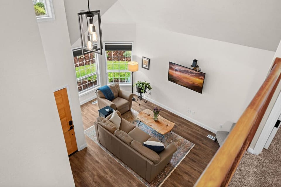 Take in the open living space from above, with comfortable Natuzzi leather seating and natural light.