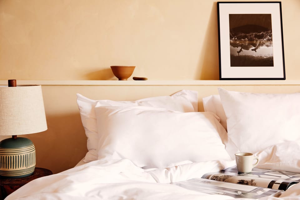 Lounge into plush pillows with bedside reading and tea.