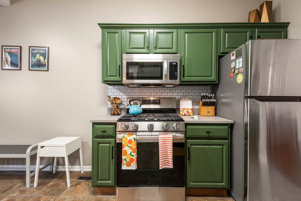 Cozy cooking nook with upgraded appliances and curated KC décor, ideal for guests exploring nearby Plaza, Westport, and downtown areas.