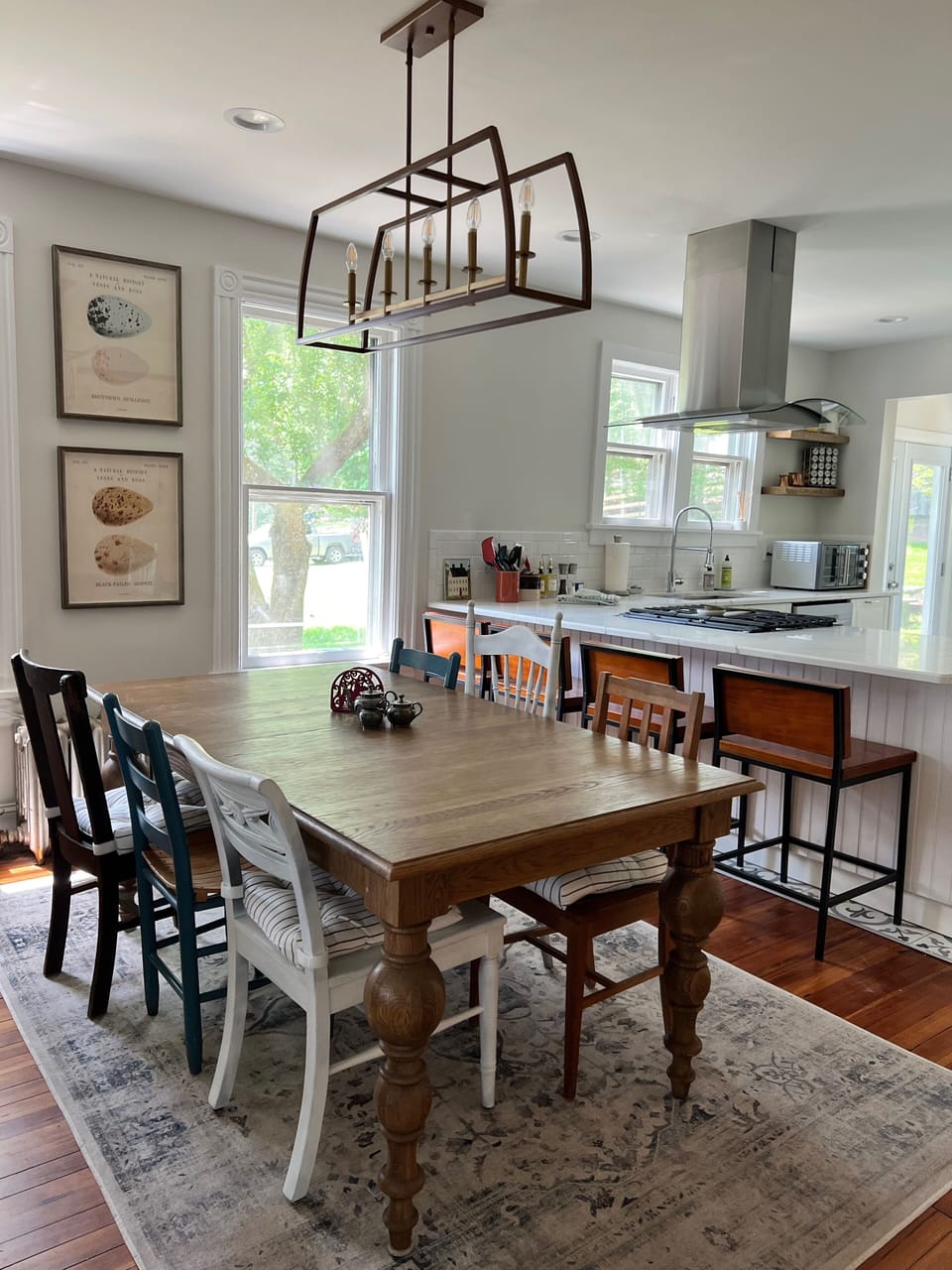 Breakfast bar and 8-person table provide plenty of seating. French door to deck.